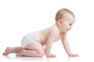 side view of pretty crawling baby