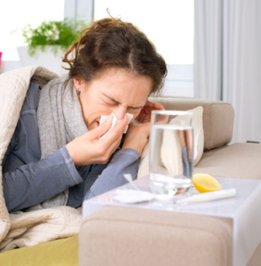 Sick Woman.Flu.Woman Caught Cold. Sneezing into Tissue