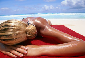 getty_rm_photo_of_woman_tanning_on_beach