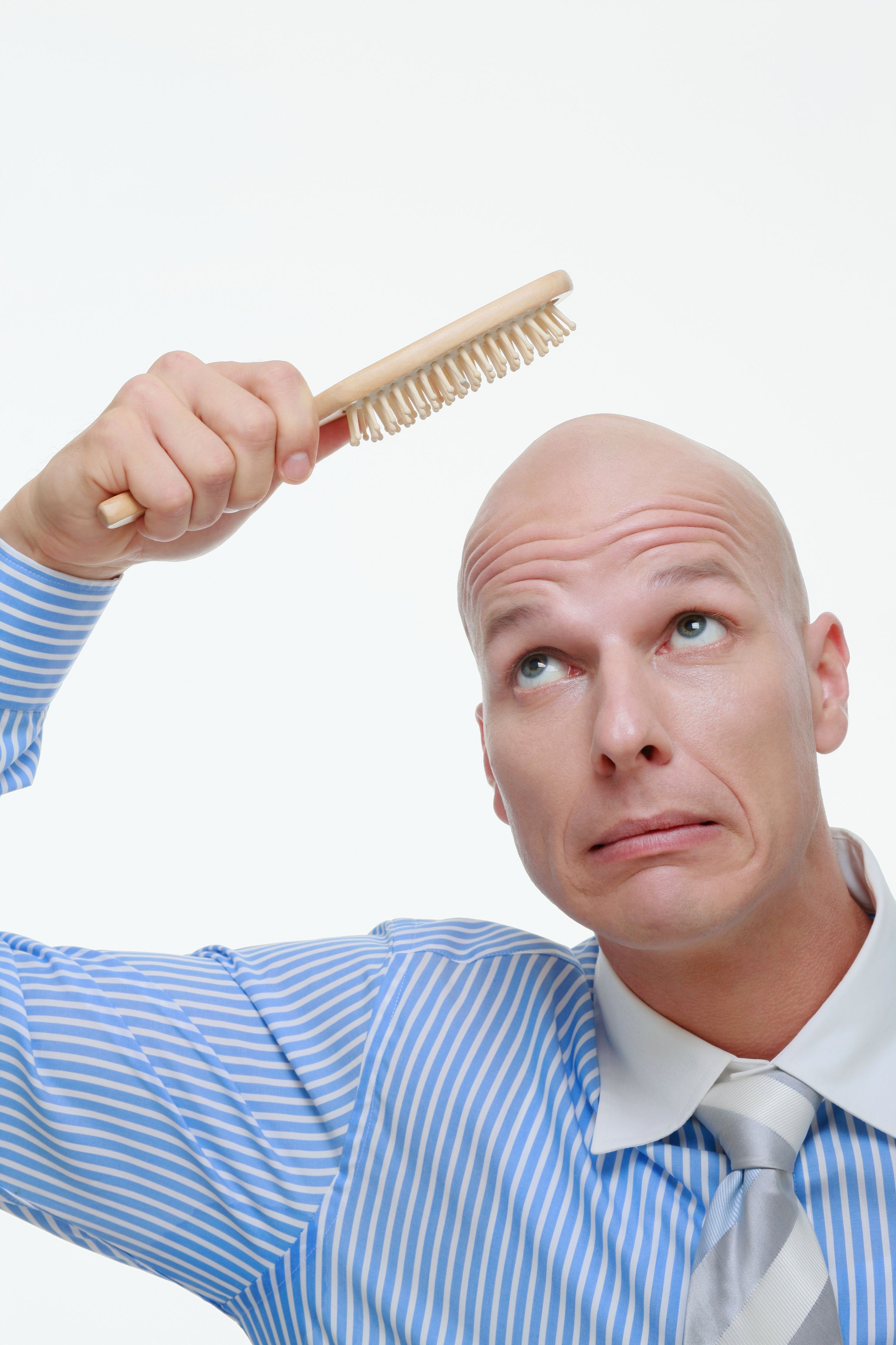 Balding-man-brushing-hair