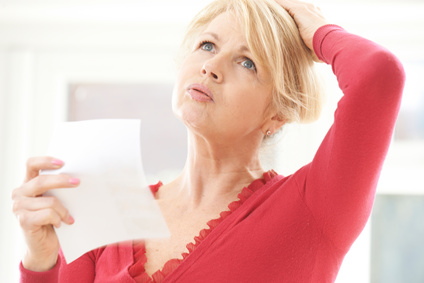 Mature Woman Experiencing Hot Flush From Menopause