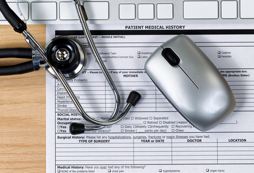 Wooden desktop with Patient history form and equipment